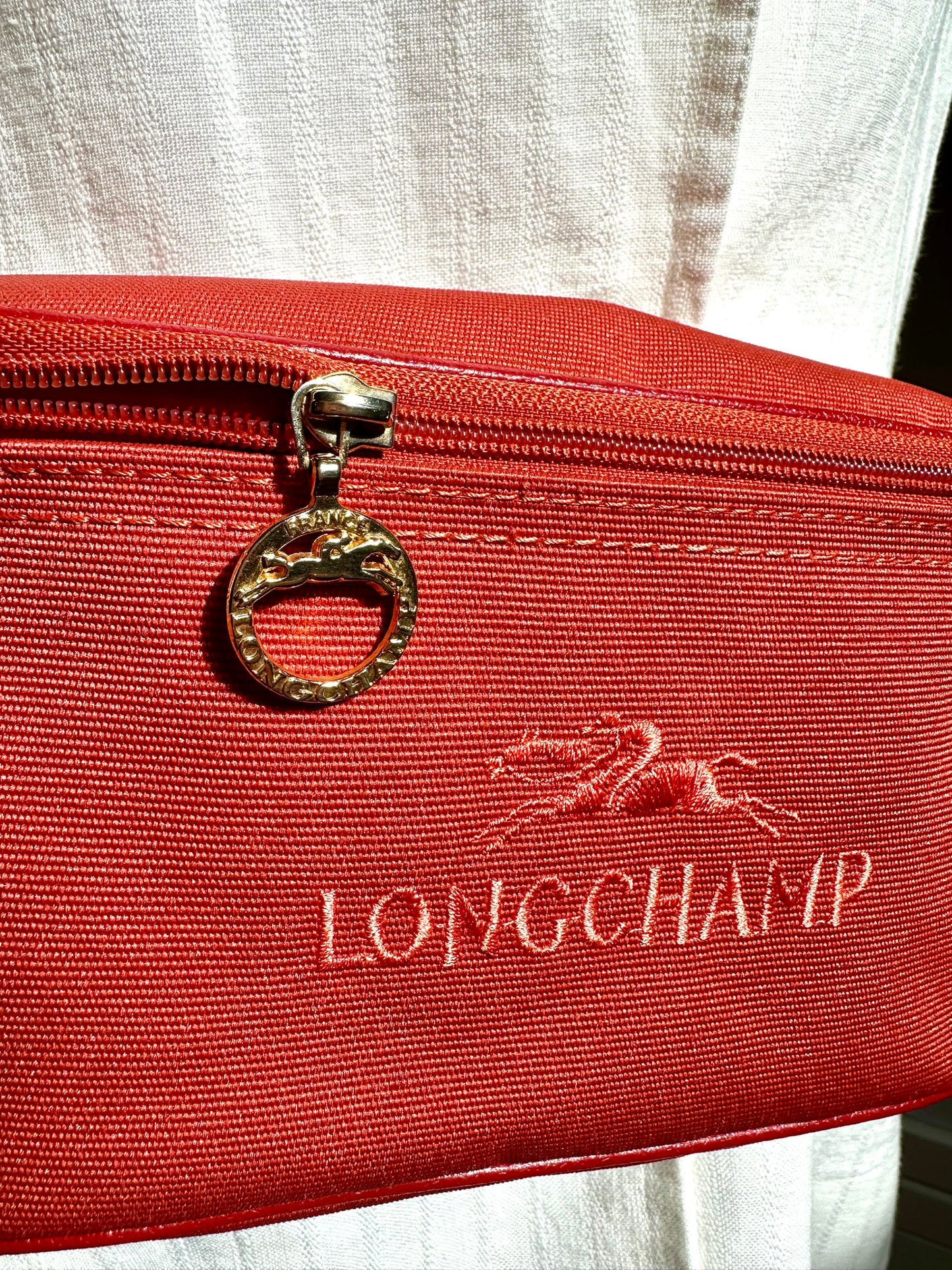 Sac banane Longchamp Le Pliage – Rouge.