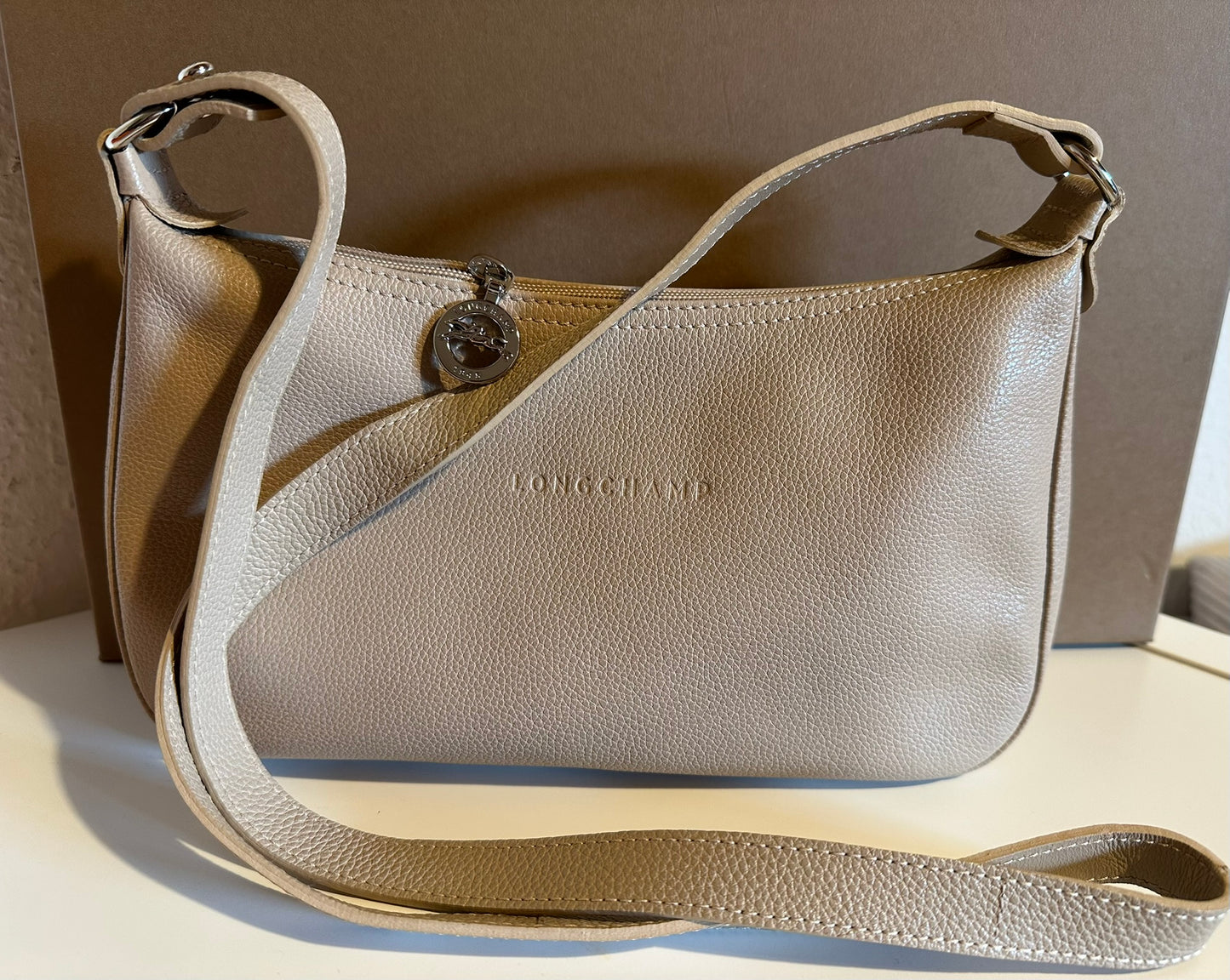 Sac Longchamp bandoulière beige - Le Foulonné.